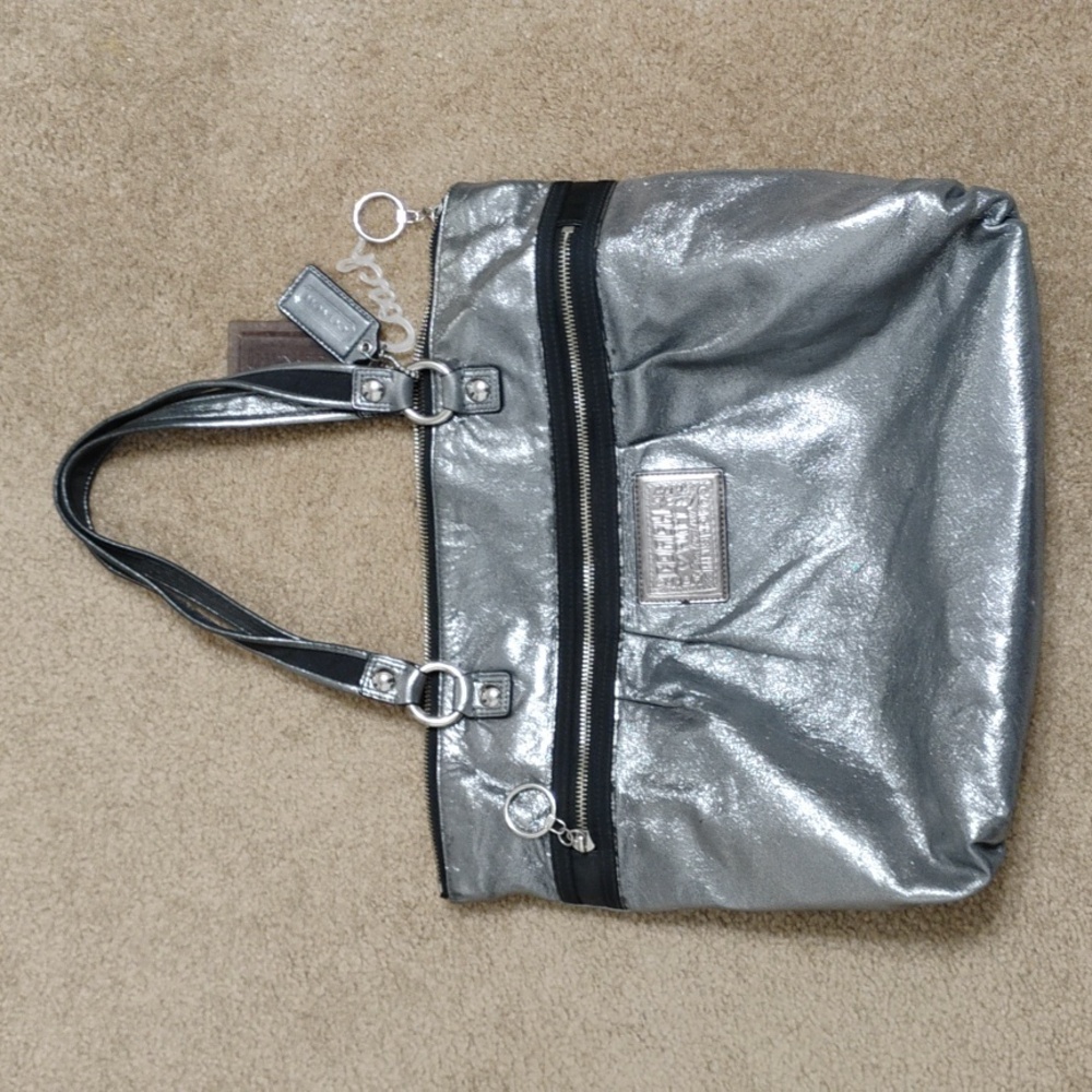 Vintage Coach Poppy Silver metallic with lavender lining.
